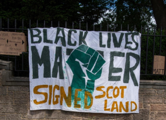 A banner that reads - Black lives matter - signed, Scotland