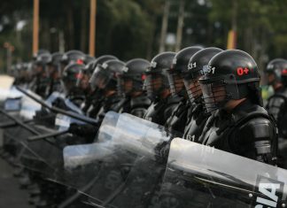 Colombian police officers. Keywords: Colombia police violence