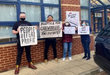 Image shows four protesters outside Mencap protesting for justice for careworkers in March 2021. Photo credit: Care and Support Workers Organise.