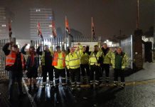 Refuse workers on strike picket their depot in Brighton with GMB flags - the Brighton refuse workers strike 2021