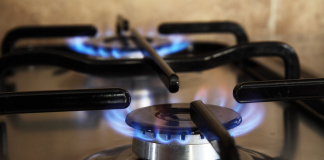 Photo shows burning hobs on a gas stove, as gas prices are set to rise dramatically in 2022.
