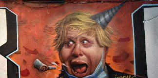 Grafitti of Jonson in a party hat with his mouth open
