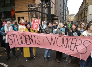 image of UCU protest in November 2019, pink banner reads 'Students + Workers'
